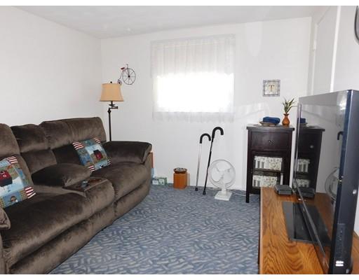 105 Hillcrest Road Waltham, MA 02451 - Photo 10 of 20 a living room with furniture and a flat screen tv