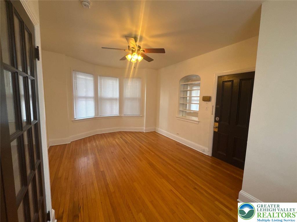 636 North New Street, Unit 3 Bethlehem, PA 18018 - Photo 3 of 10 a view of an empty room with a window and wooden floor