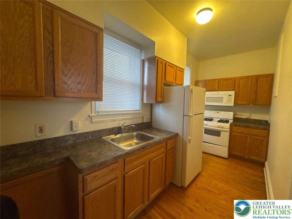 636 North New Street, Unit 3 Bethlehem, PA 18018 - Photo 8 of 10 a kitchen with a sink appliances and cabinets