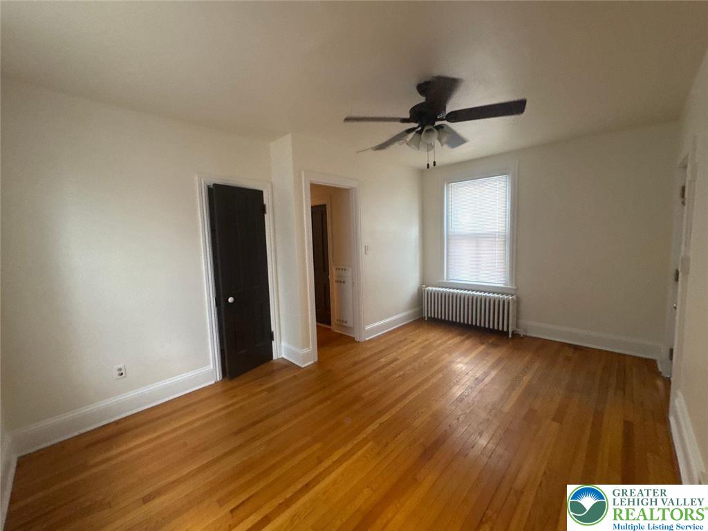 636 North New Street, Unit 3 Bethlehem, PA 18018 - Photo 9 of 10 a view of a livingroom with a hardwood floor and a ceiling fan