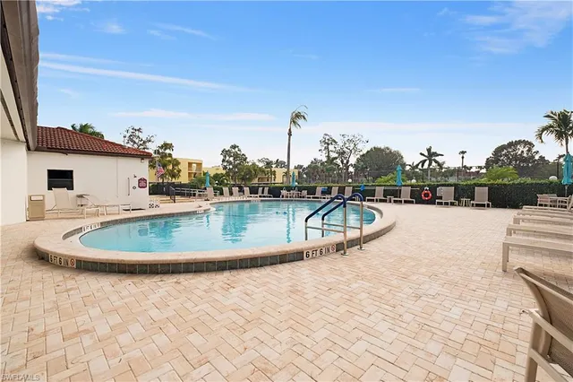 a view of a swimming pool with a terrace