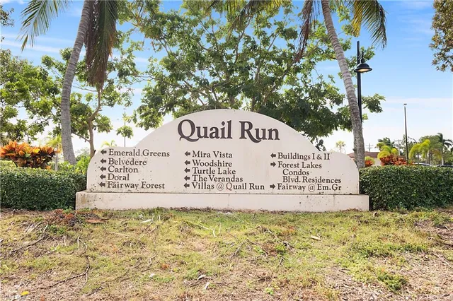 a sign of a park on a road