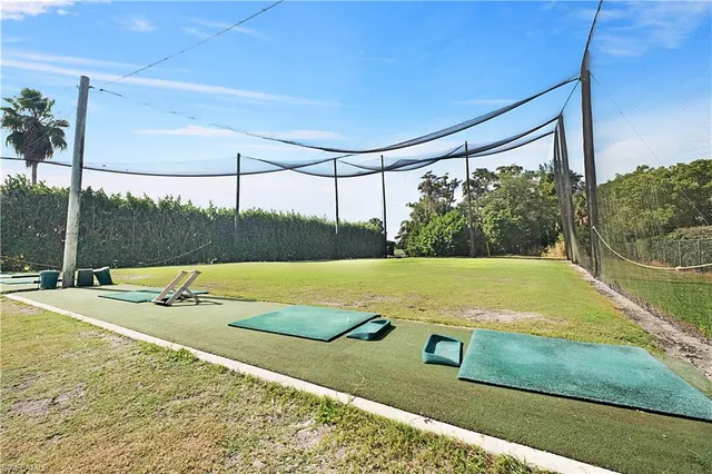 a view of a tennis ground with a large pool