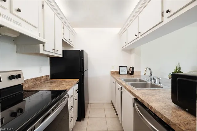 a kitchen with a sink and stove