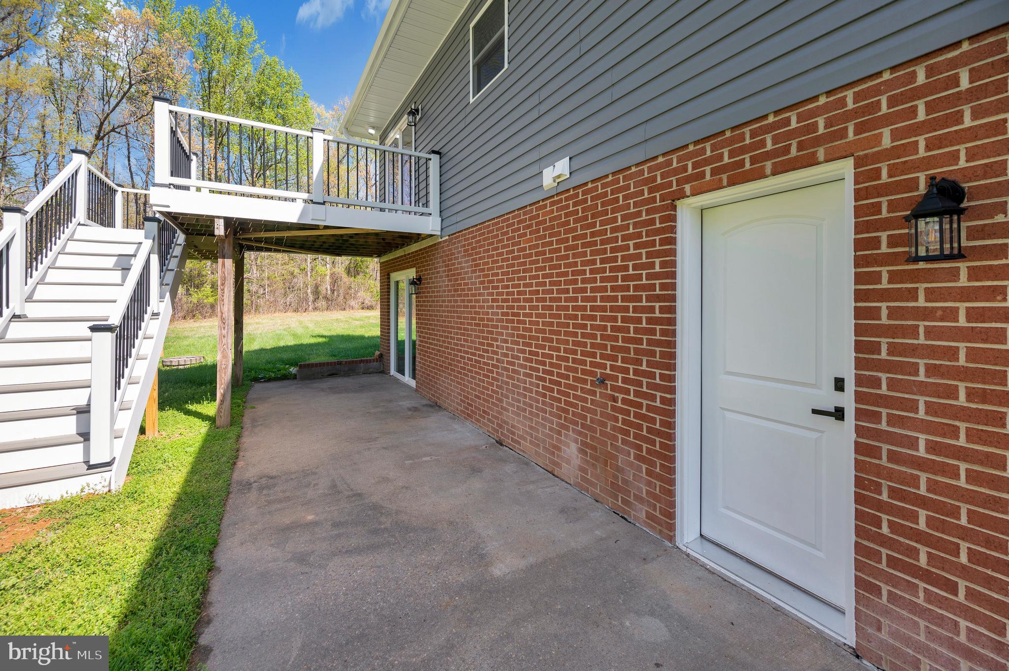 13452 Post Oak Road Spotsylvania, VA 22551 - Photo 55 of 56 a yellow house with a outdoor space