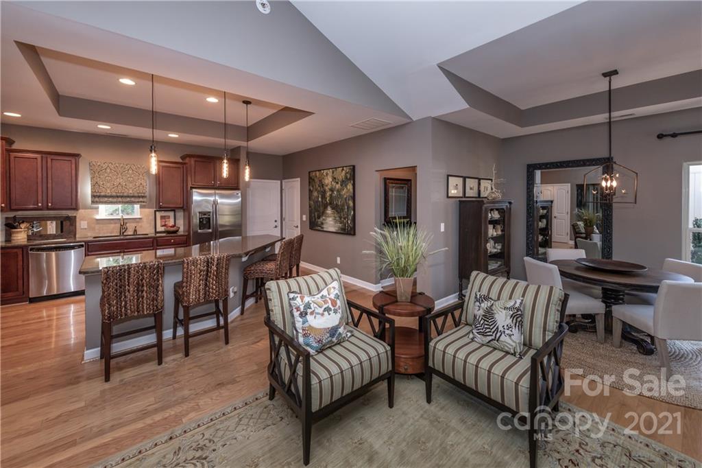 4825 Polo Gate Boulevard Charlotte, NC 28216 - Photo 12 of 30 a living room with furniture and a table