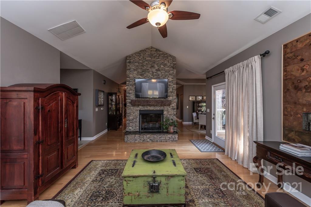 4825 Polo Gate Boulevard Charlotte, NC 28216 - Photo 15 of 30 a living room with furniture and a fireplace