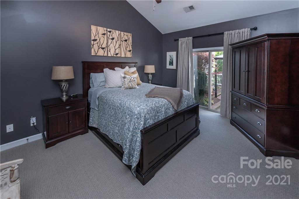 4825 Polo Gate Boulevard Charlotte, NC 28216 - Photo 18 of 30 a bedroom with a bed and a refrigerator