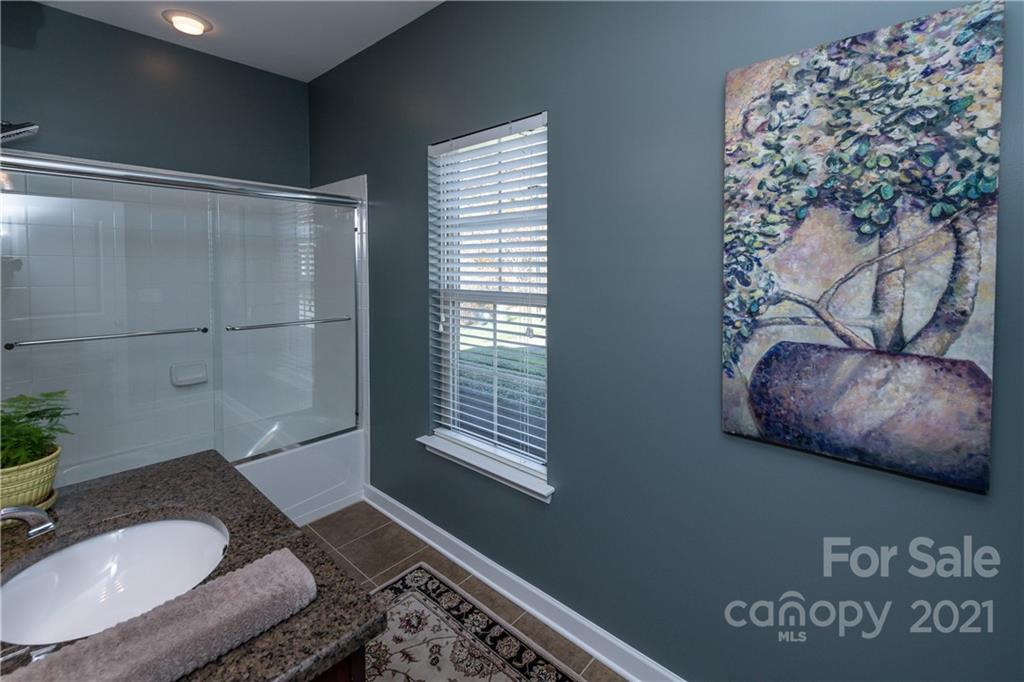 4825 Polo Gate Boulevard Charlotte, NC 28216 - Photo 24 of 30 a bathroom with a sink and a mirror