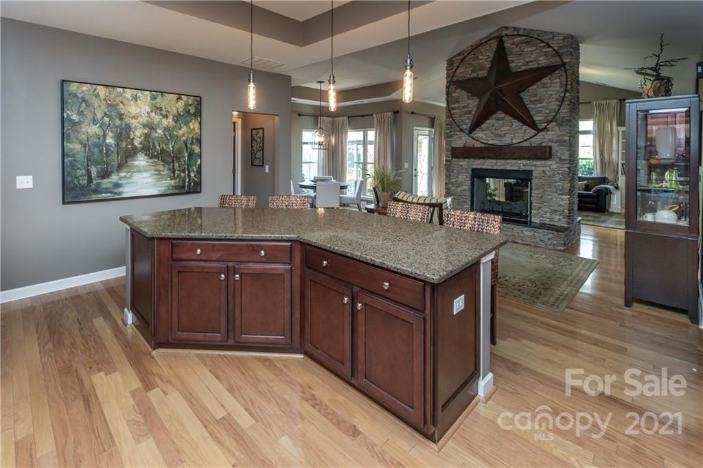 4825 Polo Gate Boulevard Charlotte, NC 28216 - Photo 7 of 30 a kitchen with a sink cabinets and wooden floor