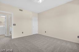 7701 West Robindale Road, Unit 277 Las Vegas, NV 89113 - Photo 21 of 33 An inviting sleeping space offers comfortable carpeting and convenient direct access to the laundry area.