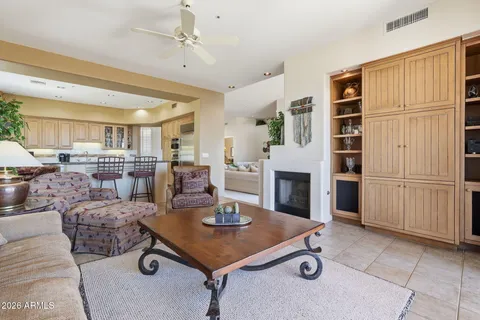 a kitchen with stainless steel appliances kitchen island granite countertop a sink and cabinets