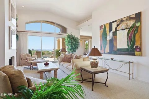 a living room with furniture and a large window