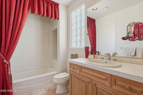 a view of a house with swimming pool and sitting area