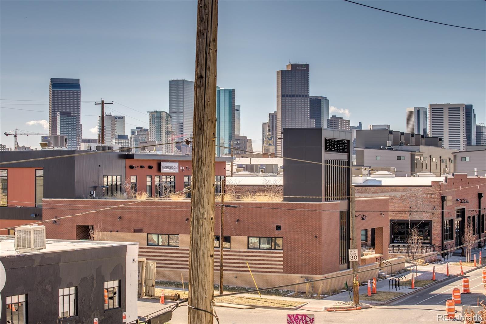 3101 Blake Street, Unit 308 Denver, CO 80205 - Photo 13 of 30 a picture of a city from a balcony