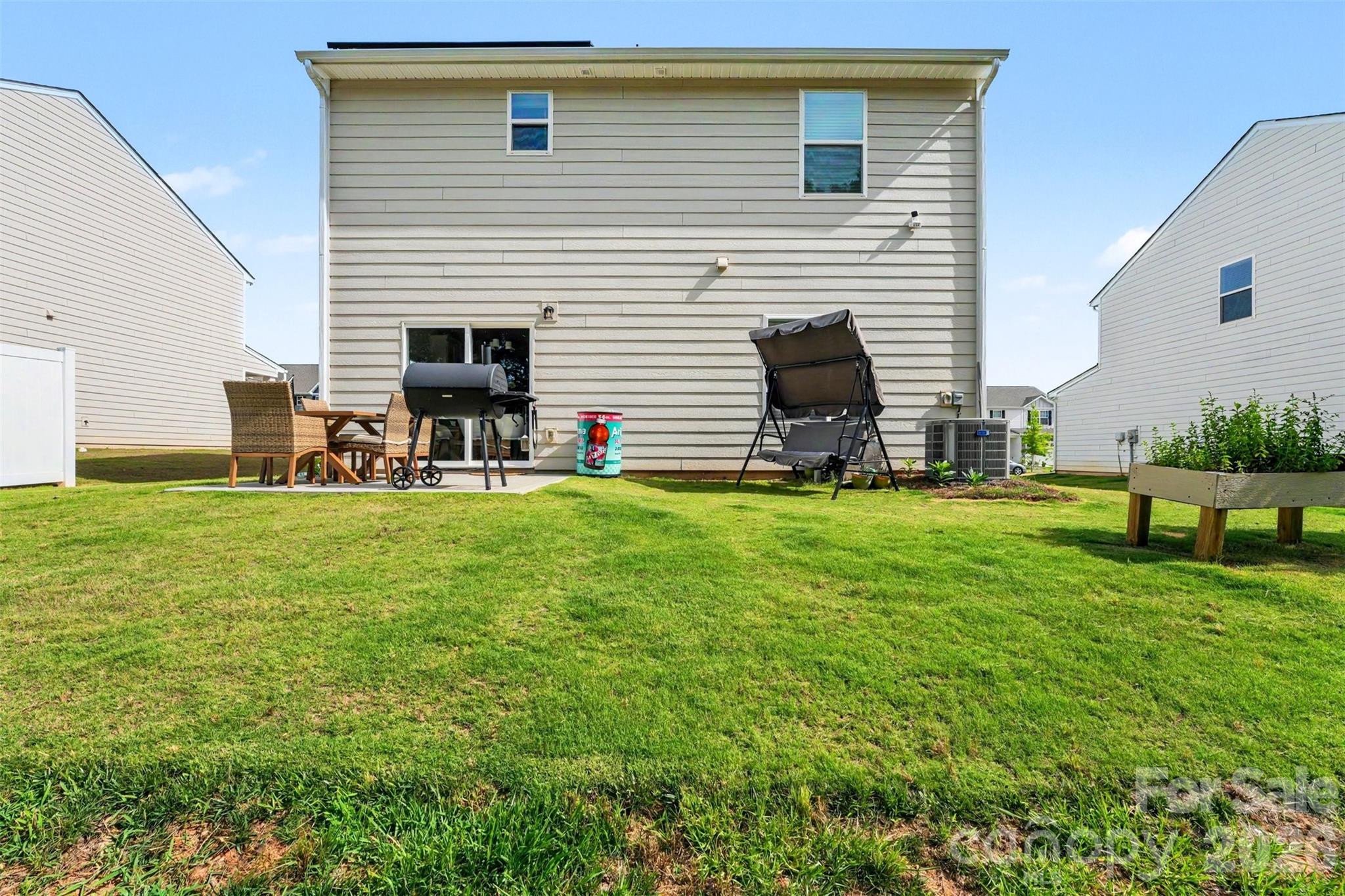 123 Brixham Loop Troutman, NC 28166 - Photo 18 of 18 a house view with a garden space
