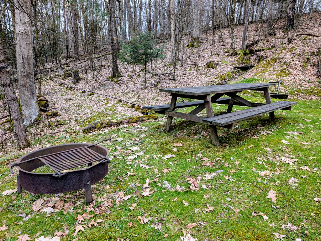 2009 Economite Road East Tidioute, PA 16351 - Photo 2 of 16 a wooden bench sitting in the backyard of a house