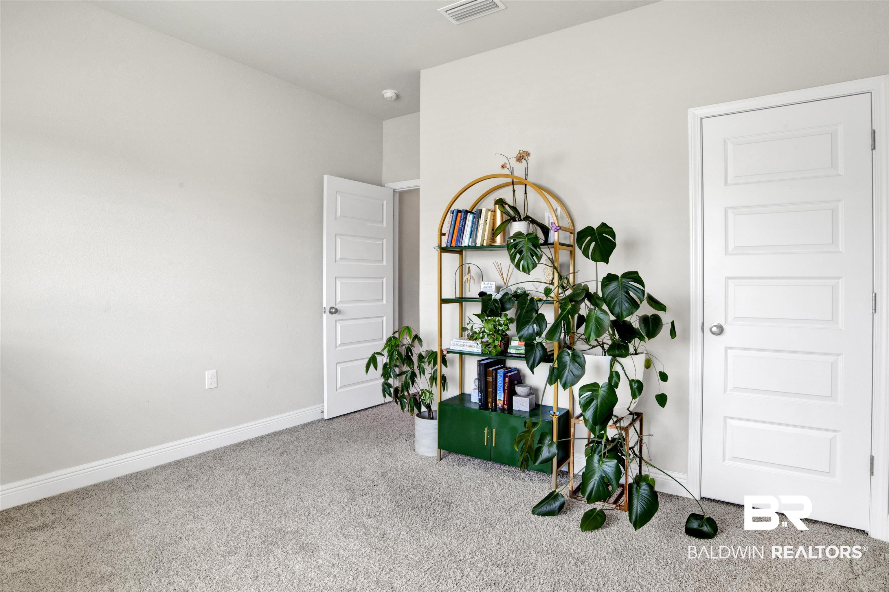 24253 Alydar Loop Daphne, AL 36526 - Photo 32 of 44 Interior space with carpet flooring and baseboards