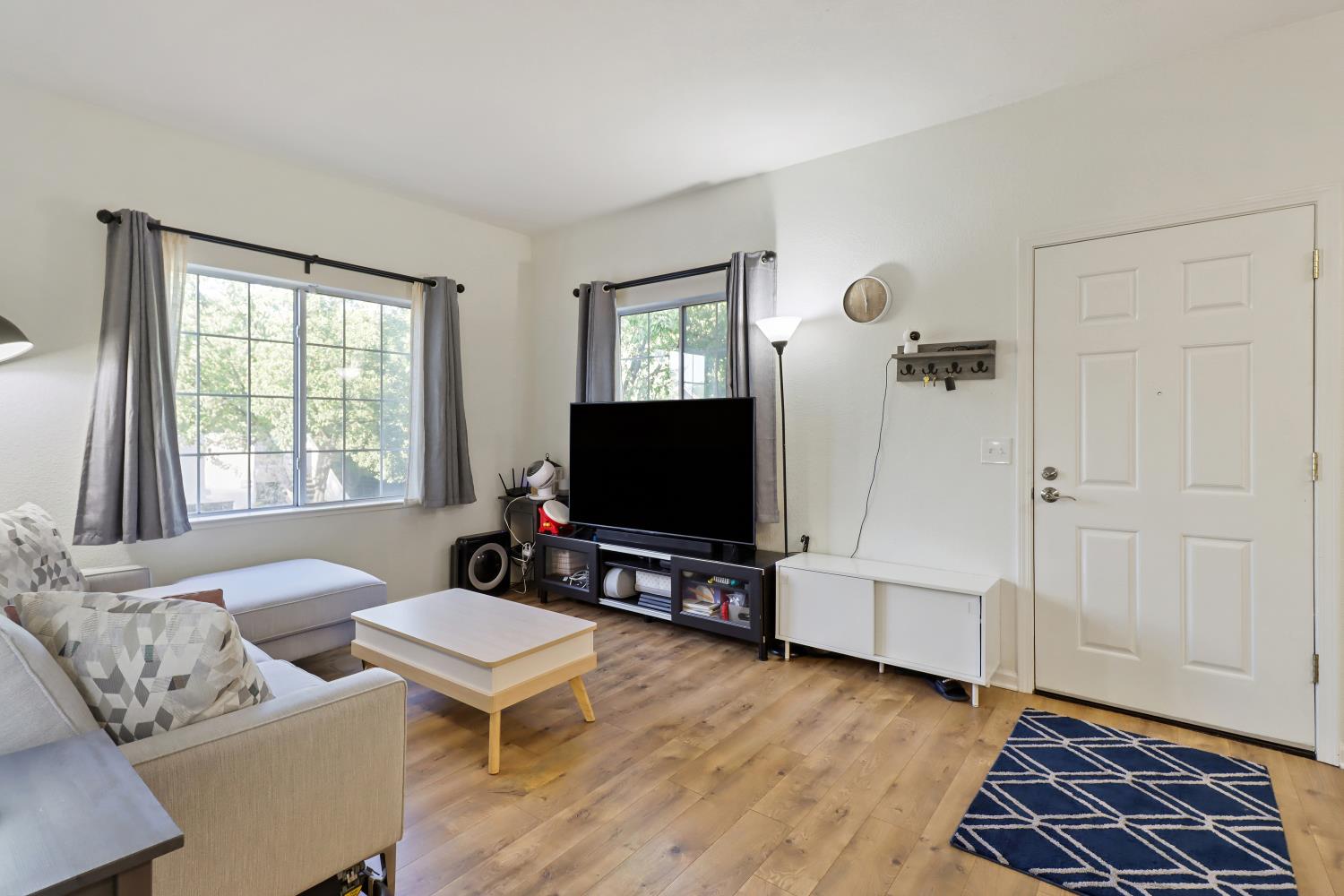 1175 Greene Terrace Davis, CA 95618 - Photo 11 of 35 a living room with furniture and a flat screen tv