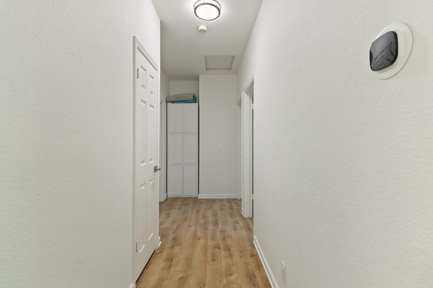 1175 Greene Terrace Davis, CA 95618 - Photo 12 of 35 a view of hallway with wooden floor