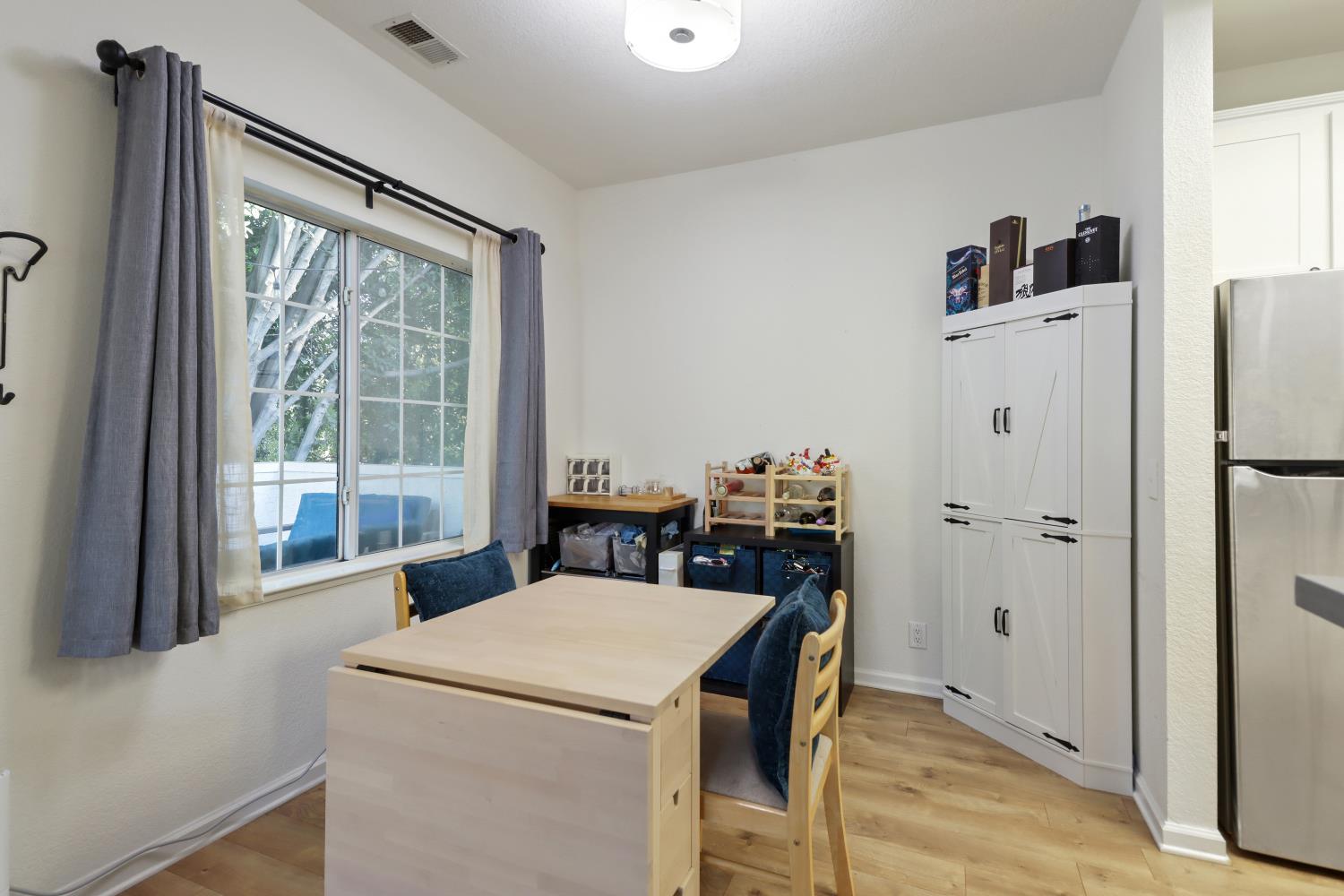 1175 Greene Terrace Davis, CA 95618 - Photo 14 of 35 a view of a kitchen that has a fridge and a stove in it
