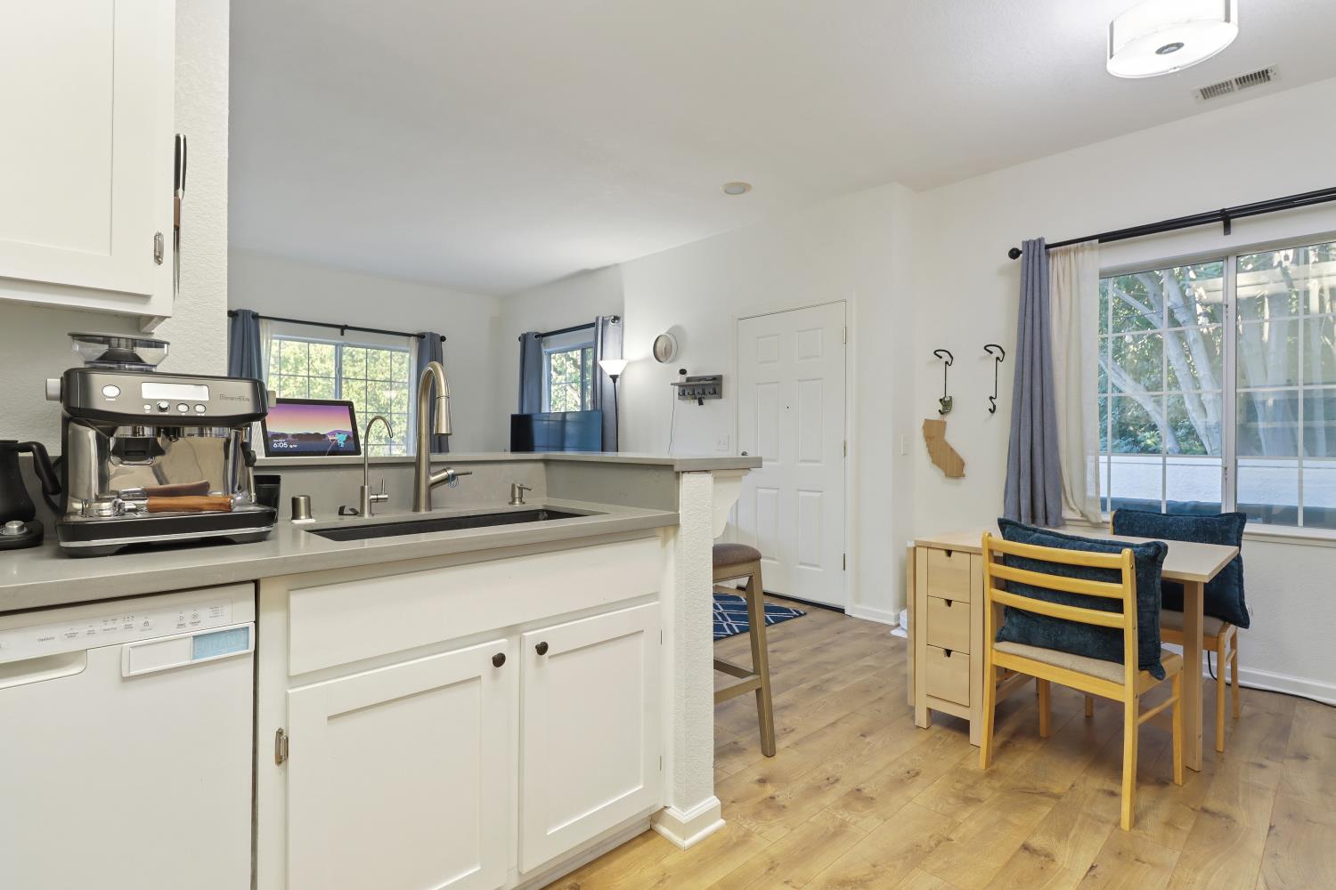 1175 Greene Terrace Davis, CA 95618 - Photo 20 of 35 a kitchen with a sink and chairs