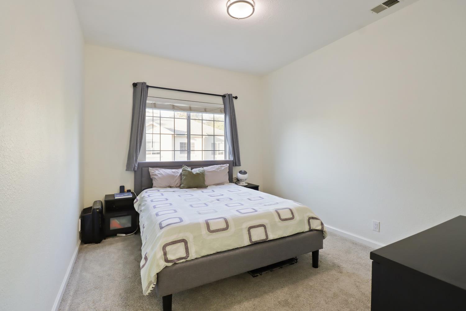 1175 Greene Terrace Davis, CA 95618 - Photo 24 of 35 a bedroom with a bed and window