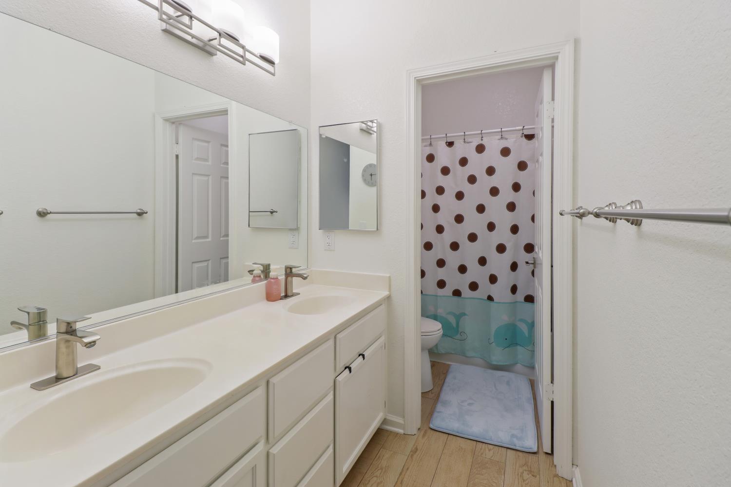 1175 Greene Terrace Davis, CA 95618 - Photo 26 of 35 a bathroom with a sink a toilet and shower