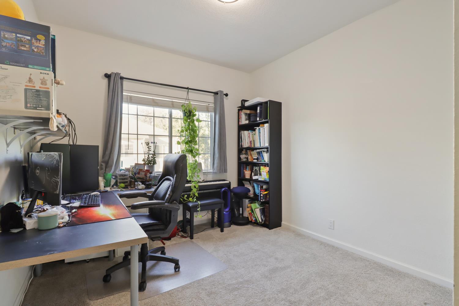 1175 Greene Terrace Davis, CA 95618 - Photo 27 of 35 a view of a workspace with furniture and a window