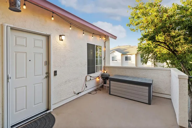 a view of outdoor space with balcony and furniture