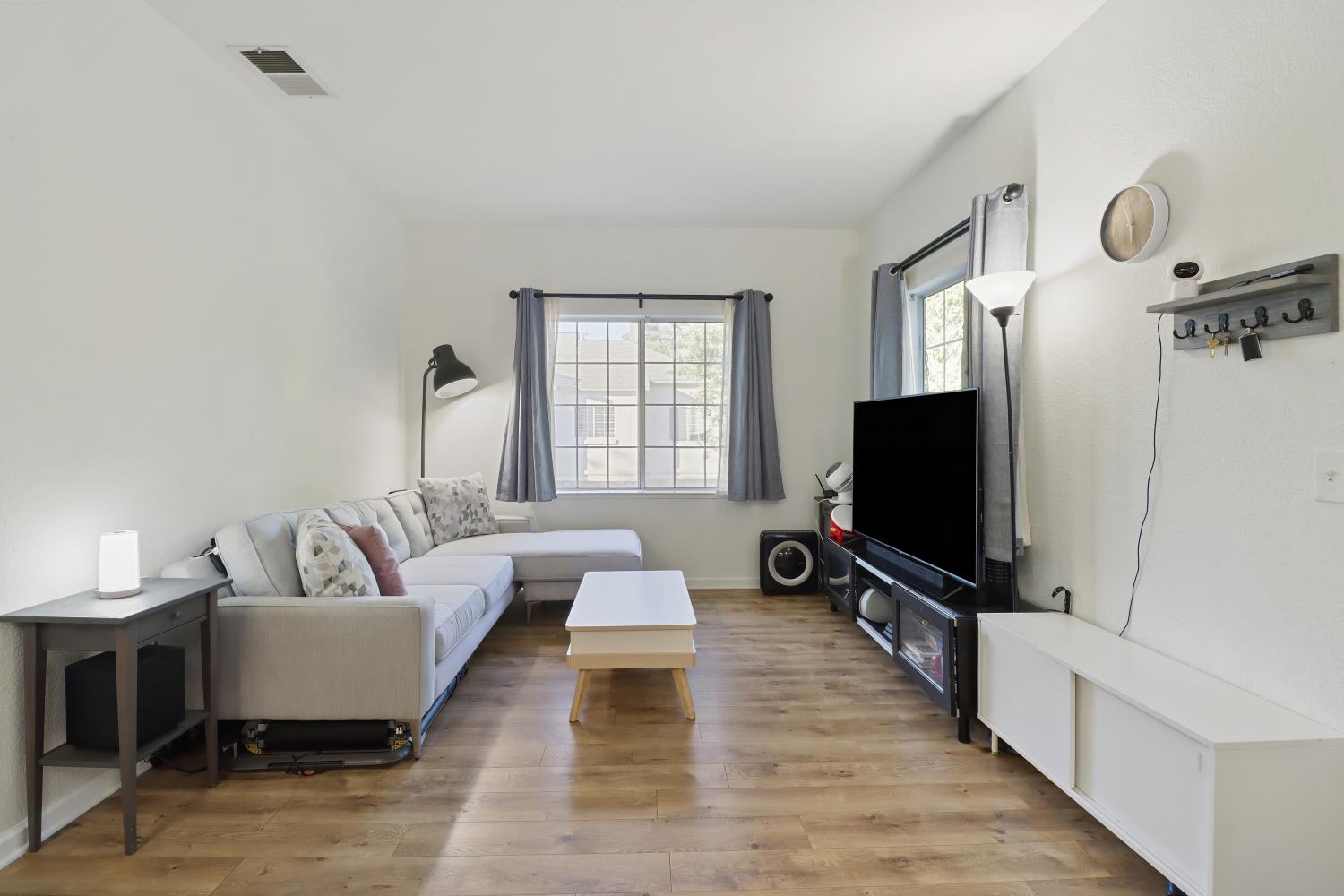 1175 Greene Terrace Davis, CA 95618 - Photo 10 of 35 a living room with furniture and a flat screen tv