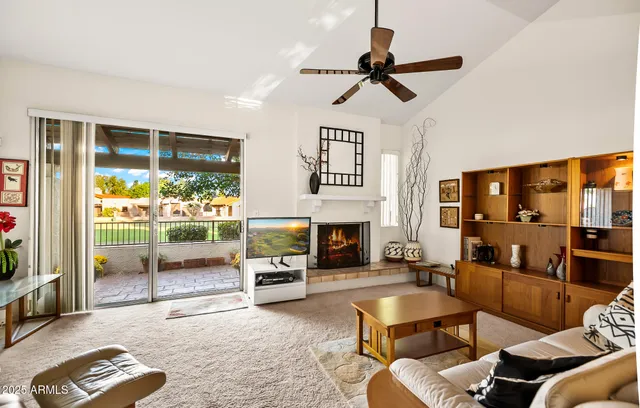 a view of a chair and tables in the balcony