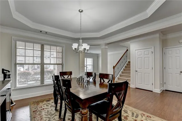 a kitchen with granite countertop kitchen island a sink appliances and a counter space