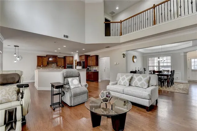 a view of kitchen with granite countertop cabinets and wooden floor