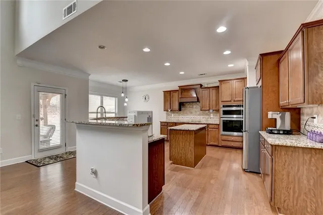 a bedroom with a bed and a ceiling fan