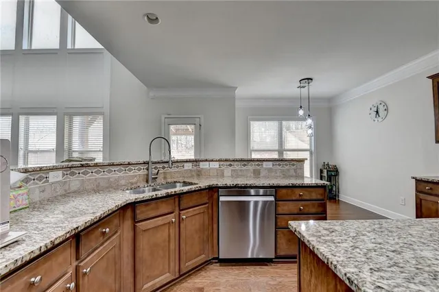 a view of a hallway with windows and stairs