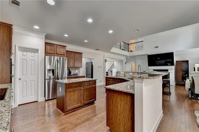 a view of an empty room with closet and a window