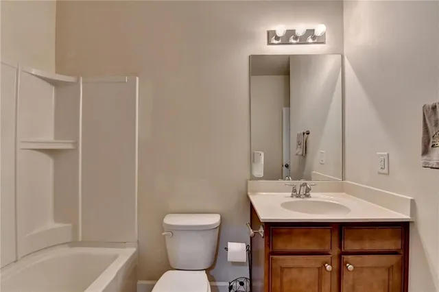 a bed sitting in a room next to a window