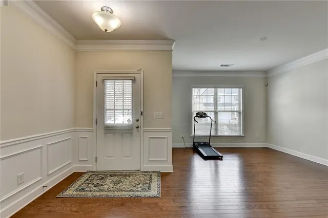 a view of a dining room with furniture window and wooden floor