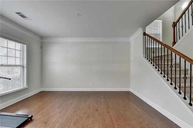 a living room with furniture window and wooden floor