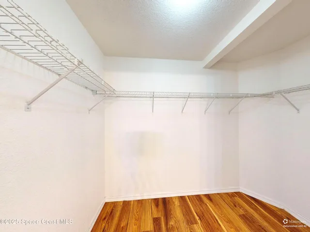 a view of a room with racks on the wall