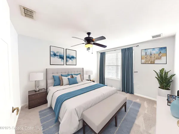 a bedroom with a large bed and a chandelier