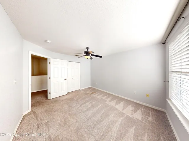 a view of a room with a large window