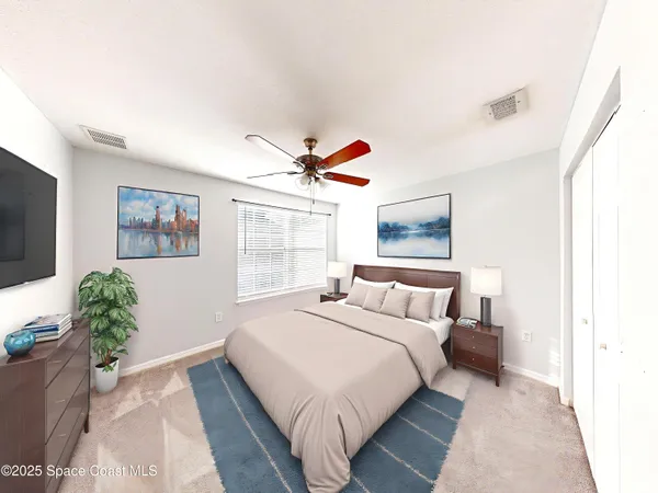 a bedroom with a large bed and a flat screen tv