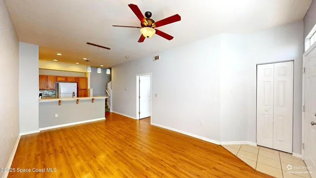 a bedroom with a bed and a view of kitchen