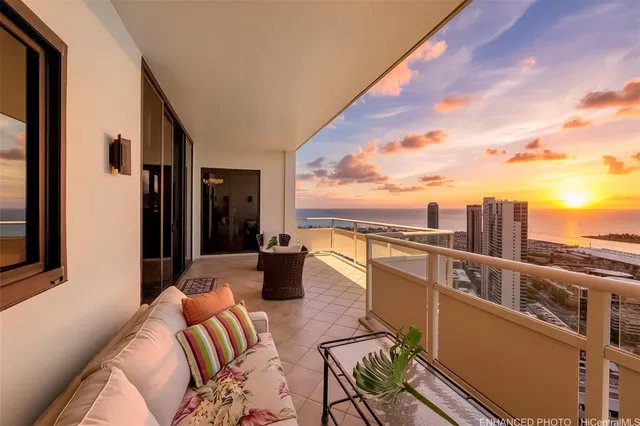 a view of balcony with couch and chairs
