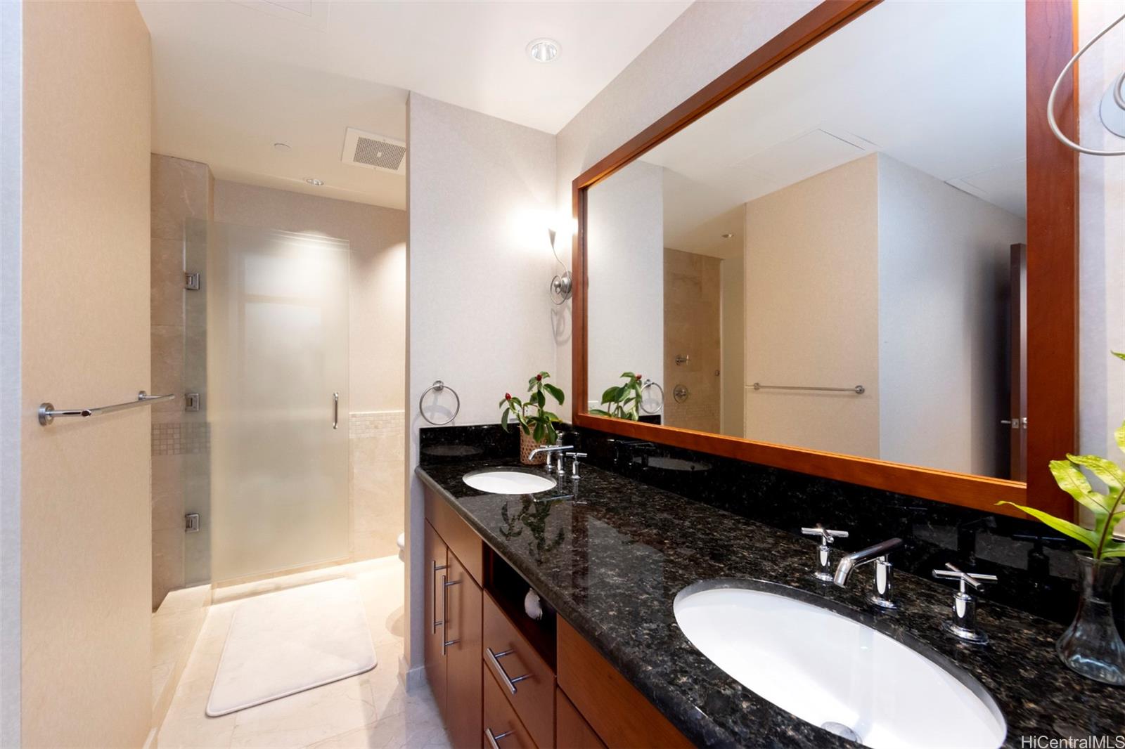 600 Queen Street, Unit 4302 Honolulu, HI 96813 - Photo 18 of 25 a bathroom with a granite countertop sink and a mirror