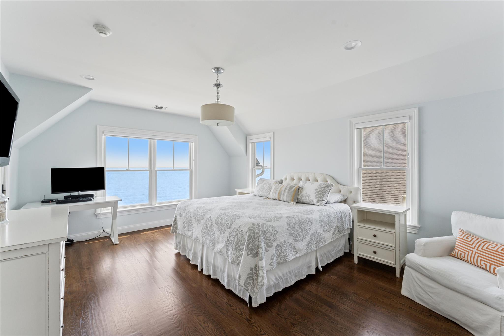 9 Shinnecock Road East Quogue, NY 11942 - Photo 13 of 34 a bedroom with a bed and a flat screen tv
