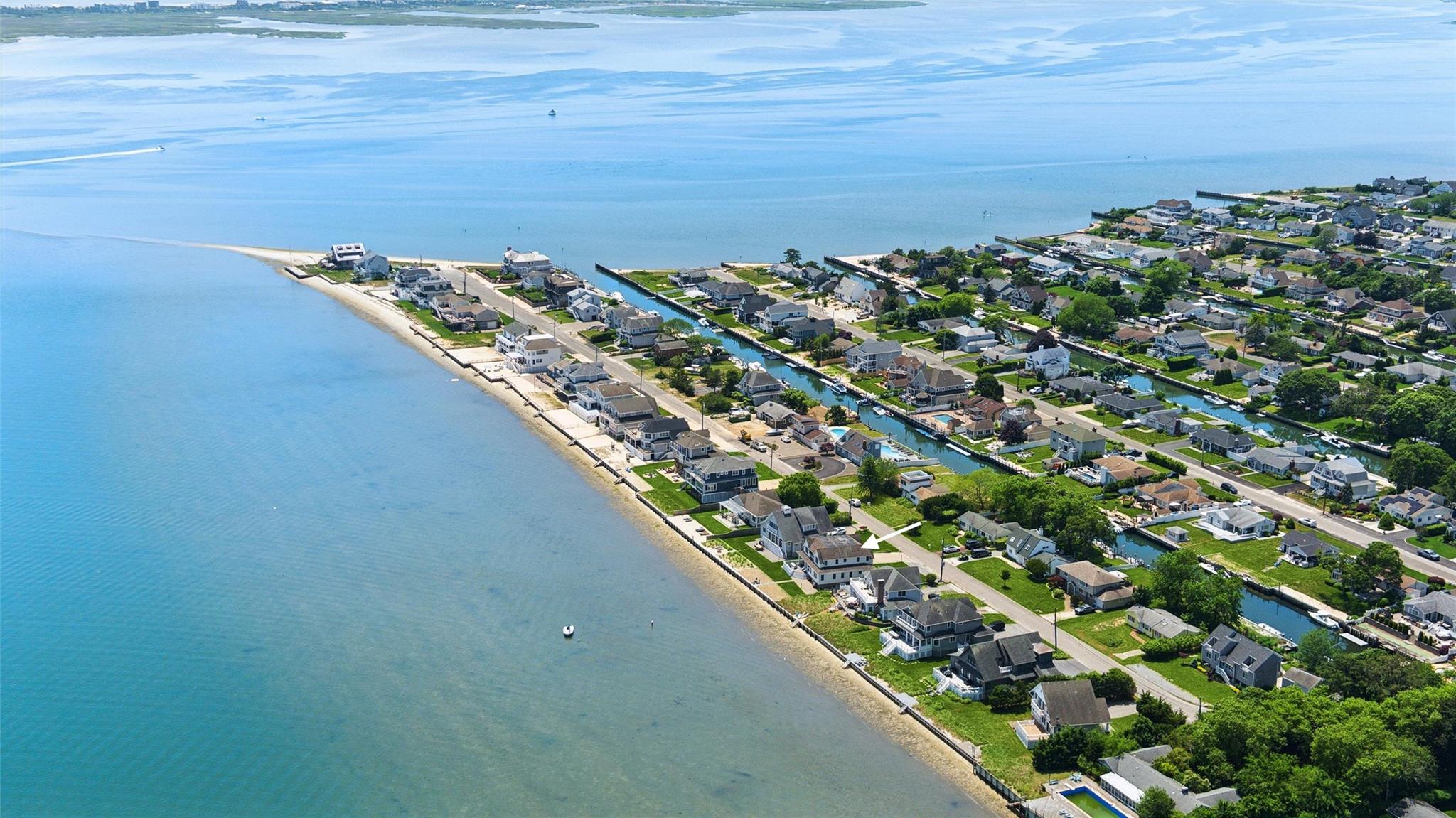 9 Shinnecock Road East Quogue, NY 11942 - Photo 31 of 34 a view of a lake with a mountain