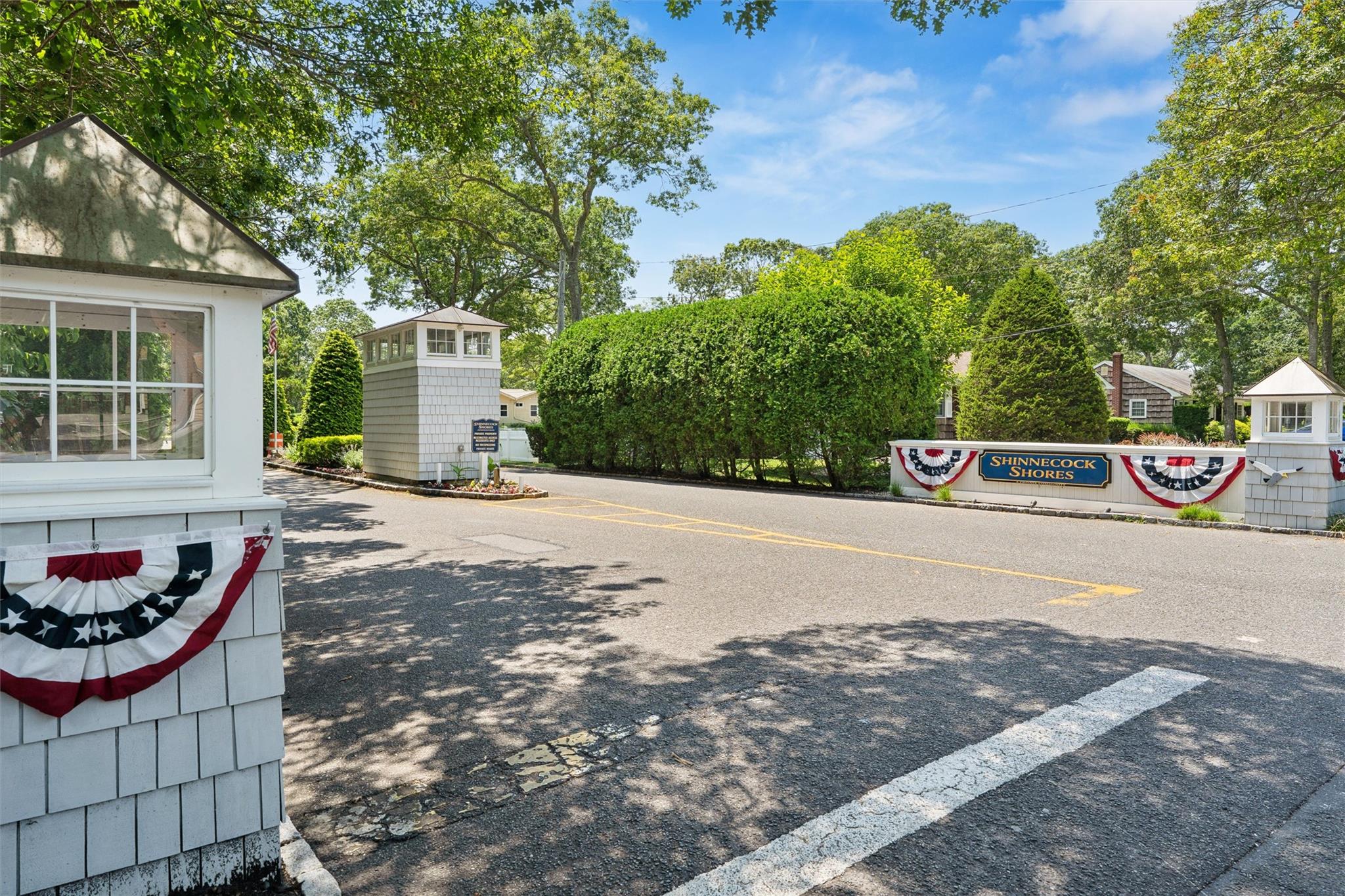 9 Shinnecock Road East Quogue, NY 11942 - Photo 34 of 34 a front view of a house with a yard